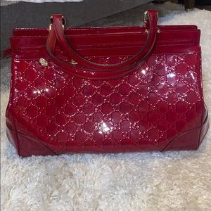 Red Gucci patient leather purse